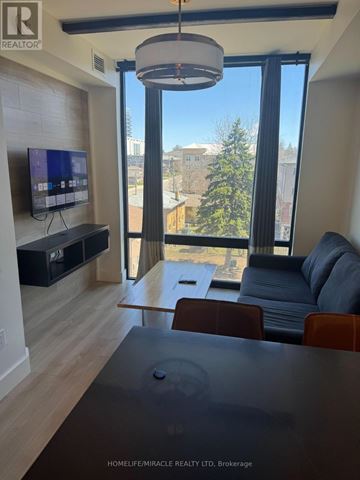 Waterloo condo for rent - A living room with a television and a couch.