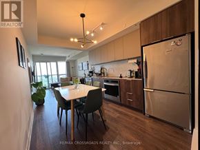 Toronto (Flemingdon Park) condo for rent - A kitchen with a table and chairs in the middle of the room.