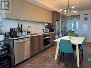 Toronto (Flemingdon Park) condo for rent - A kitchen with a table and chairs in front of it.