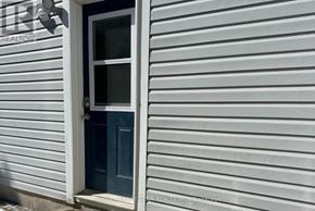 Whitby (Brooklin) apartment for rent - A house with a blue door and a window.