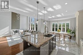 Vaughan (Maple) apartment for rent - A modern kitchen with a granite countertop and stainless steel appliances.