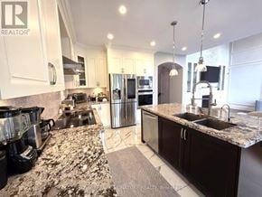 Vaughan (Maple) apartment for rent - A kitchen with granite countertops and stainless steel appliances.
