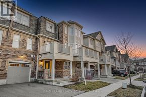 Milton (Wi Willmott) townhouse for rent - A row of townhouses with a sign that says "Brad J. Lamb Realty 2016 Inc. Brokerage".