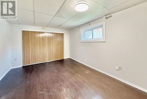 Whitby (Blue Grass Meadows) apartment for rent - A room with a wooden floor and a sliding door.