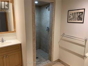 Richmond Hill (Crosby) apartment for rent - A bathroom with a glass shower door and a white sink.