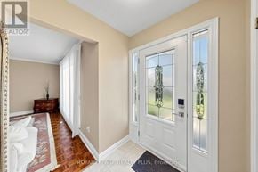 Oakville (Wo West) apartment for rent - A white door with a glass window is in a room with a carpet.