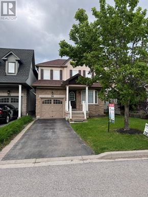 Whitby (Brooklin) apartment for rent - A house with a realtor sign in front of it.