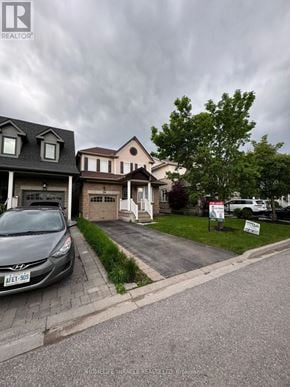 Whitby (Brooklin) apartment for rent - A grey car is parked in front of a house with a sign that says "For Sale".