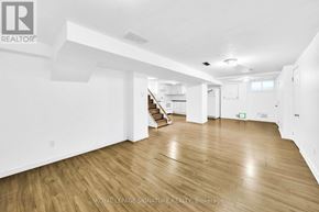 Newmarket (Central Newmarket) apartment for rent - A spacious room with wooden flooring and white walls.