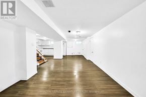 Newmarket (Central Newmarket) apartment for rent - A long hallway with wooden floors and white walls.