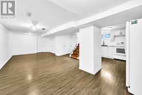 Newmarket (Central Newmarket) apartment for rent - A spacious room with wooden flooring and white walls.