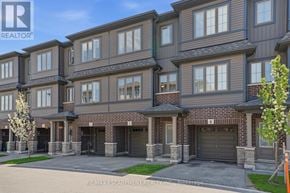 Cambridge townhouse for rent - A building with the RE/MAX Escarpment Realty logo on it.