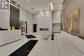 Milton (Walker) condo for rent - A reception area with a white reception desk and a white sofa.