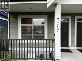 Richmond apartment for rent - A house numbered 7717 is shown with a black front door.