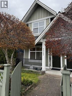 Richmond apartment for rent - A house with a grey front porch and a black gate.