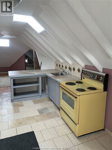 Chatham apartment for rent - A yellow stove in a kitchen with a tiled floor and a skylight.