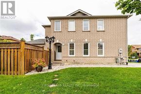 Vaughan (Maple) apartment for rent - A brick house with a wooden fence in front.