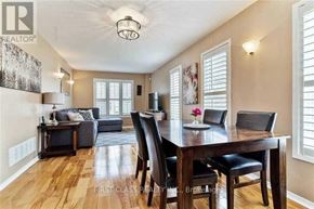 Vaughan (Maple) apartment for rent - A dining room with a wooden table and chairs.