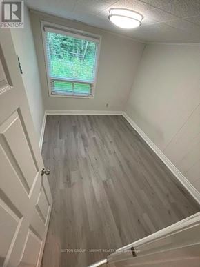 Markham (Markham Village) apartment for rent - A room with a window and wooden flooring.