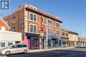 Hamilton (Gibson) apartment for rent - A street view of a city with buildings, cars, and a clear sky.