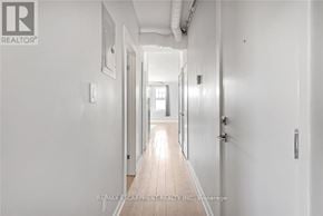 Hamilton (Gibson) apartment for rent - A long hallway with white walls and wooden floors.