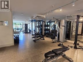 Coquitlam apartment for rent - A gym with a variety of equipment including a weight bench.