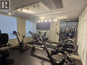 Coquitlam apartment for rent - A gym with a row of exercise bikes.