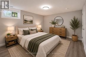 Brantford apartment for rent - A bedroom with a bed, nightstands, and a plant.