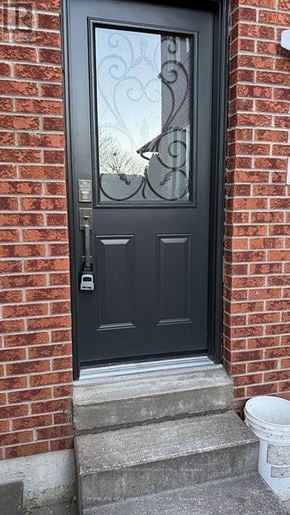Pickering (West Shore) apartment for rent - A black door with a glass window and a metal handle.