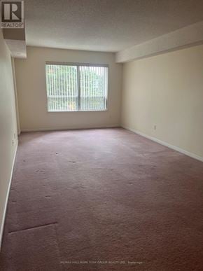 Barrie (Letitia Heights) condo for rent - A room with a window and carpeted floor.