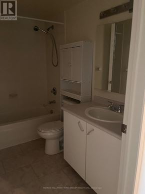 Barrie (Letitia Heights) condo for rent - A white bathroom with a toilet, sink, and shower.