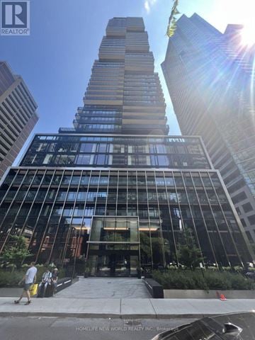 Toronto (Church-Yonge Corridor) condo for rent - A modern living room with a fireplace and a large painting on the wall.