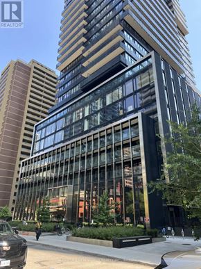 Toronto (Church-Yonge Corridor) condo for rent - A modern living room with a fireplace and a large painting on the wall.