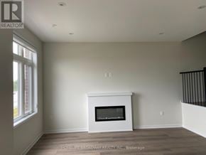 Richmond Hill townhouse for rent - A room with a fireplace and a window.