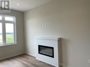 Richmond Hill townhouse for rent - A white fireplace in a room with a window.