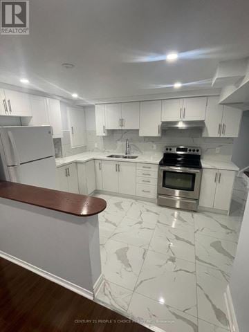 Mississauga (Hurontario) apartment for rent - A modern kitchen with white cabinets and a marble floor.