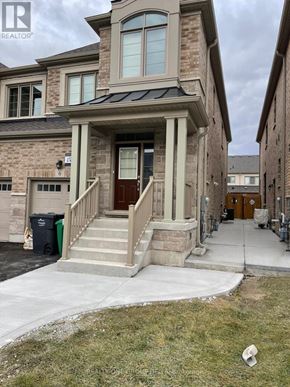 Brampton (Bram West) apartment for rent - A house with a brown door and a small porch.