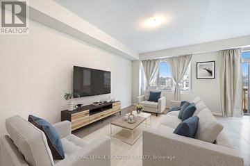 Thorold (Rolling Meadows) apartment for rent - A living room with a grey couch and a flat screen TV.