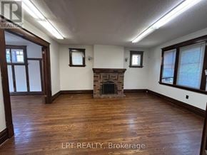 Ottawa apartment for rent - A room with a fireplace and wood flooring.