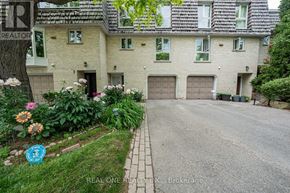 Toronto (St. Andrew-Windfields) townhouse for rent - A house with a driveway and a sign that says REALTOR.