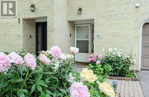 Toronto (St. Andrew-Windfields) townhouse for rent - A building with the number 87 on it and a sign that says REALTOR.