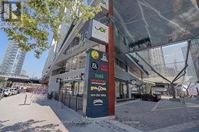 Toronto (Waterfront Communities) condo for rent - A street view of a shopping center with various stores including Montfort, Chasera, and a brew pub.