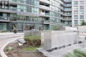 Toronto (Niagara) condo for rent - A modern building with a water feature in front.