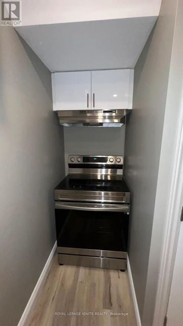Whitby (Williamsburg) apartment for rent - A small kitchen with a stainless steel oven and microwave.