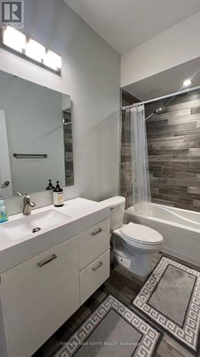 Whitby (Williamsburg) apartment for rent - A bathroom with a sink, toilet, and a shower.