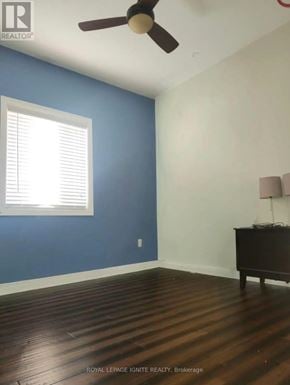 Whitby (Williamsburg) apartment for rent - A room with a ceiling fan and a window with blinds.