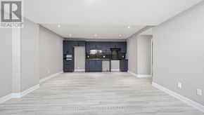 Russell apartment for rent - A spacious room with a kitchen area in the background.