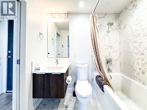 Vancouver apartment for rent - A bathroom with a white toilet and a white sink.