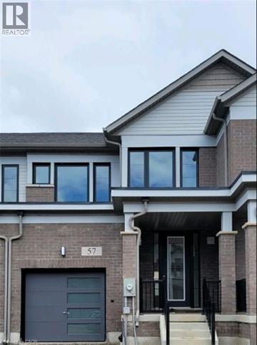 Mount Hope townhouse for rent - A modern house with a grey garage door and a black front door.
