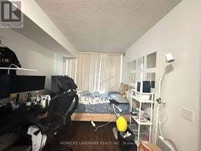Toronto (Bayview Village) condo for rent - A room with a bed, desk, and chair.